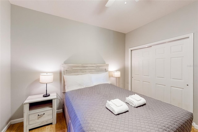 bedroom featuring a closet, ceiling fan, and light hardwood / wood-style floors