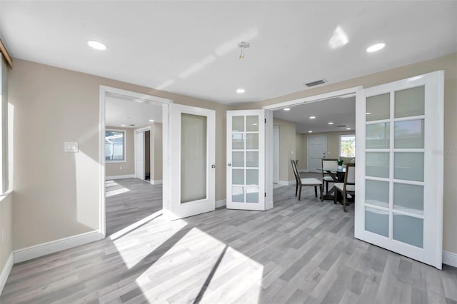 interior space featuring light hardwood / wood-style floors and french doors