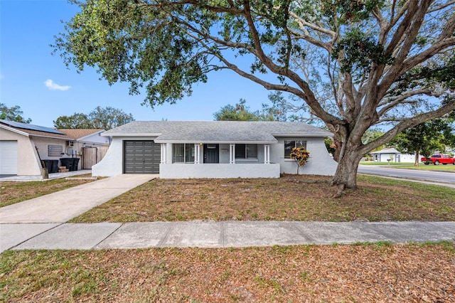 ranch-style house featuring a garage