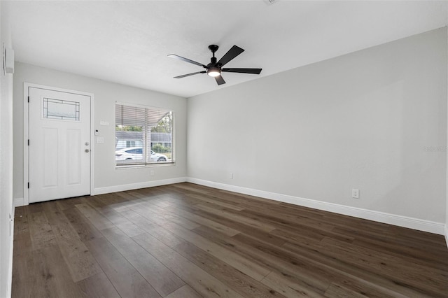 interior space with ceiling fan and dark hardwood / wood-style flooring