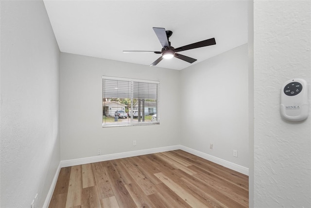 unfurnished room with ceiling fan and light hardwood / wood-style floors