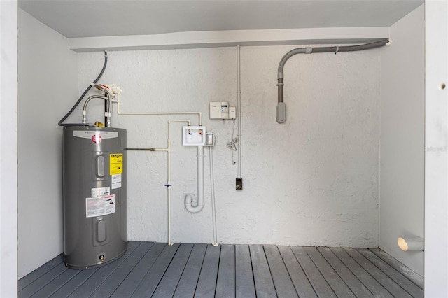 utility room featuring water heater