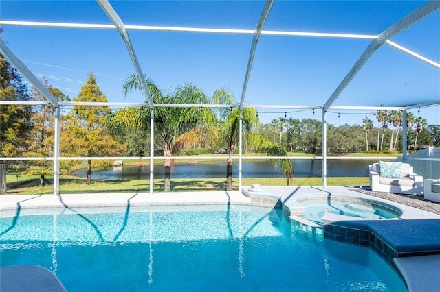 view of pool featuring an in ground hot tub, a water view, and glass enclosure