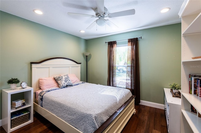 bedroom featuring ceiling fan and dark hardwood / wood-style floors