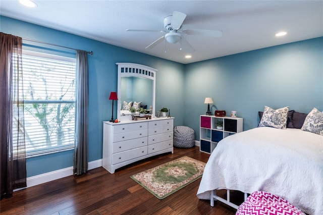 bedroom with dark hardwood / wood-style floors and ceiling fan