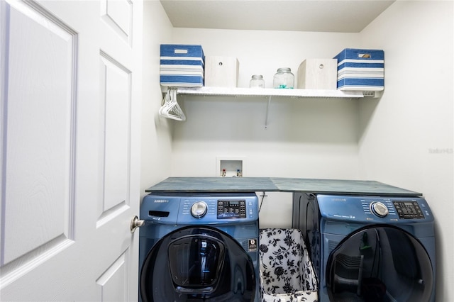 clothes washing area with washer and dryer