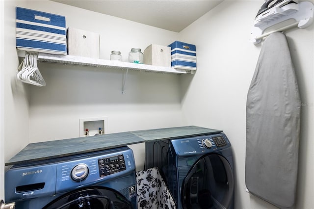 laundry area featuring washing machine and dryer