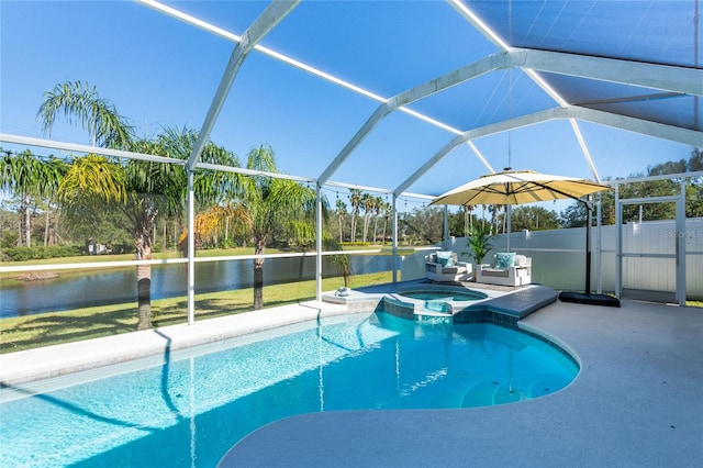 view of swimming pool featuring a lanai, a patio area, an in ground hot tub, and a water view