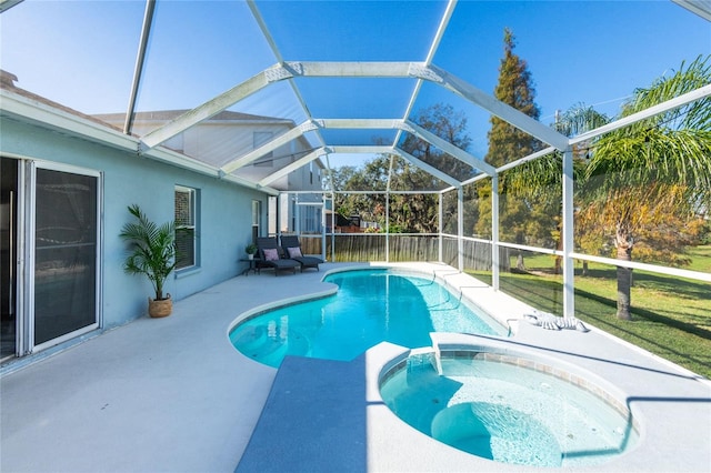 view of swimming pool with a lanai, a patio area, an in ground hot tub, and a lawn