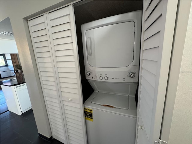 laundry room featuring laundry area and stacked washer and dryer