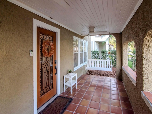 doorway to property featuring covered porch