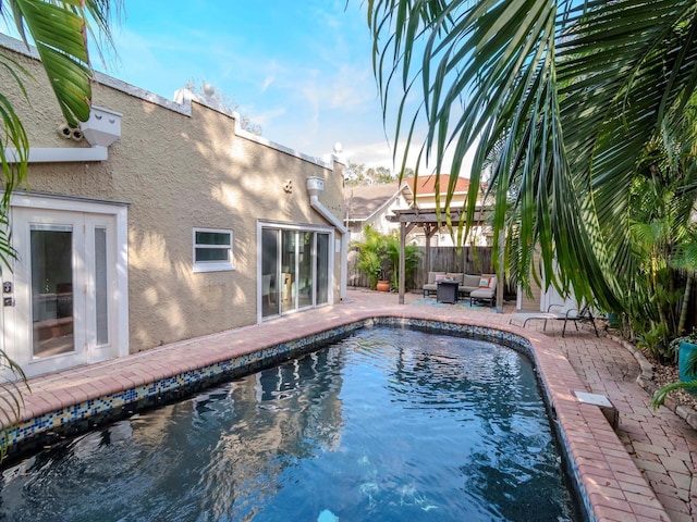 view of pool featuring an outdoor hangout area, a pergola, and a patio