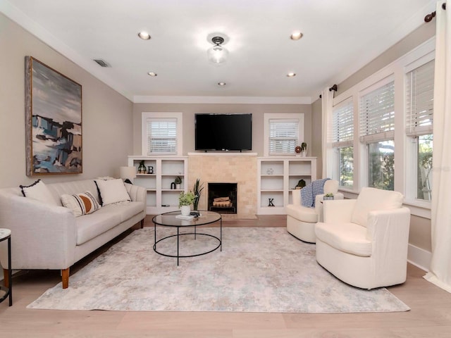 living room featuring crown molding and hardwood / wood-style floors