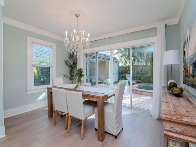 dining area featuring a notable chandelier and light hardwood / wood-style floors