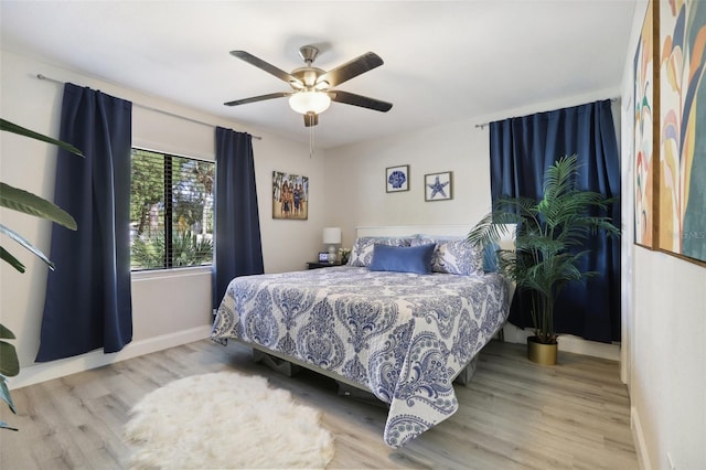 bedroom featuring ceiling fan and light hardwood / wood-style floors