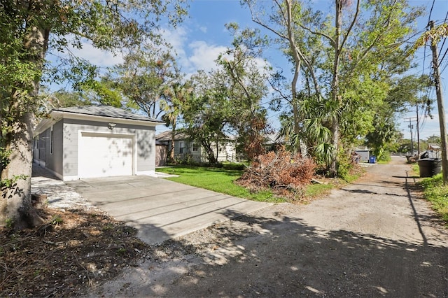 exterior space with a garage and a front yard