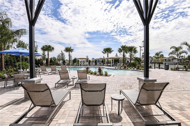 view of patio featuring a community pool