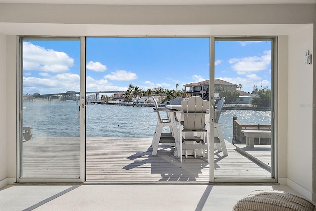 interior space featuring a wealth of natural light and a water view