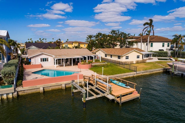 dock area with a patio area and a water view