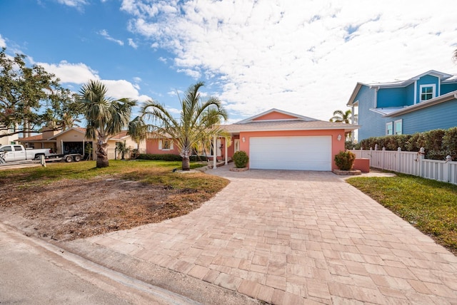 view of front facade featuring a front lawn and a garage