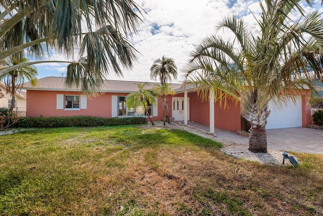 single story home with a front lawn and a garage