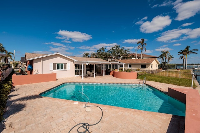 view of swimming pool with a patio area