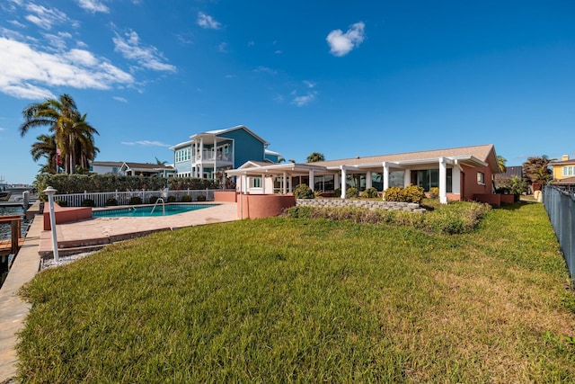 view of yard featuring a fenced in pool and a patio area