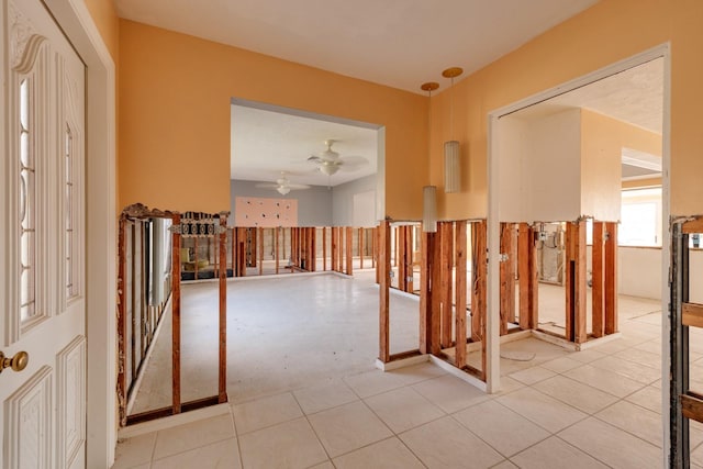 interior space featuring ceiling fan and light tile patterned flooring