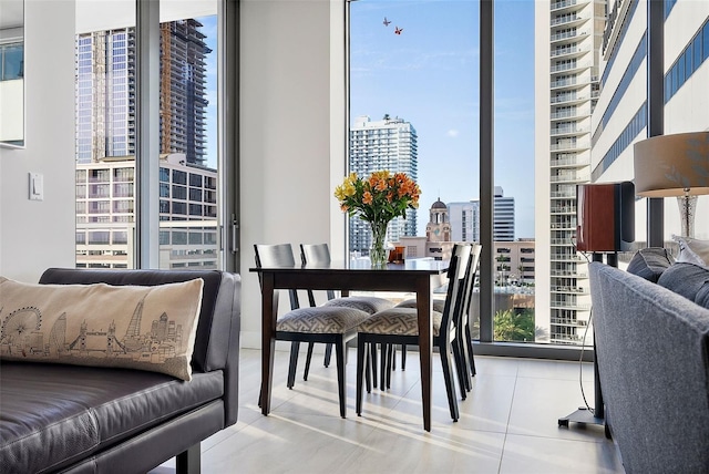 dining room with a wealth of natural light and light tile patterned floors