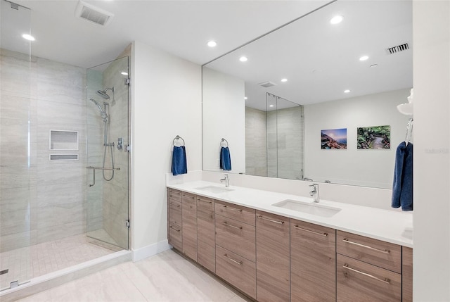 bathroom with vanity and an enclosed shower