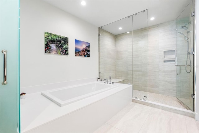 bathroom featuring shower with separate bathtub and tile patterned floors