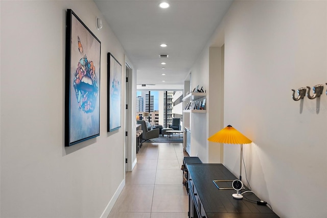 corridor featuring light tile patterned floors