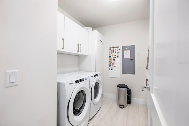 laundry area featuring cabinets, independent washer and dryer, and electric panel