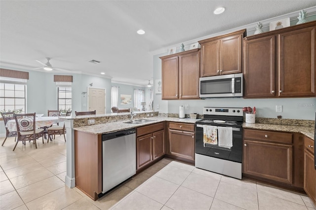 kitchen featuring ceiling fan, sink, stainless steel appliances, kitchen peninsula, and crown molding