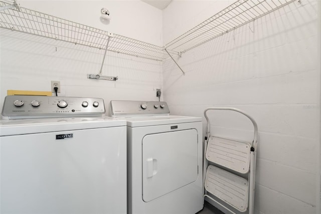 laundry area featuring washing machine and clothes dryer