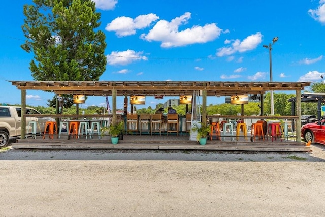 view of community featuring an outdoor bar