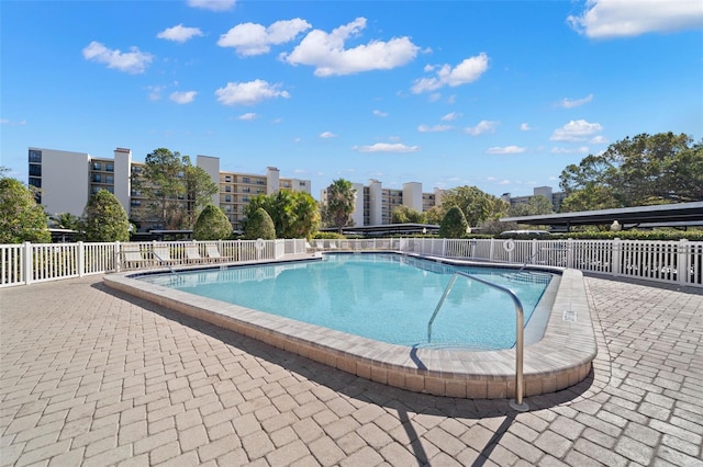 view of pool featuring a patio area