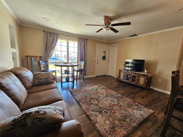 3141 Ludlow Dr, New Port Richey, FL 34655 - living room with a ceiling fan, a textured ceiling, ornamental molding, dark wood-style flooring, and baseboards