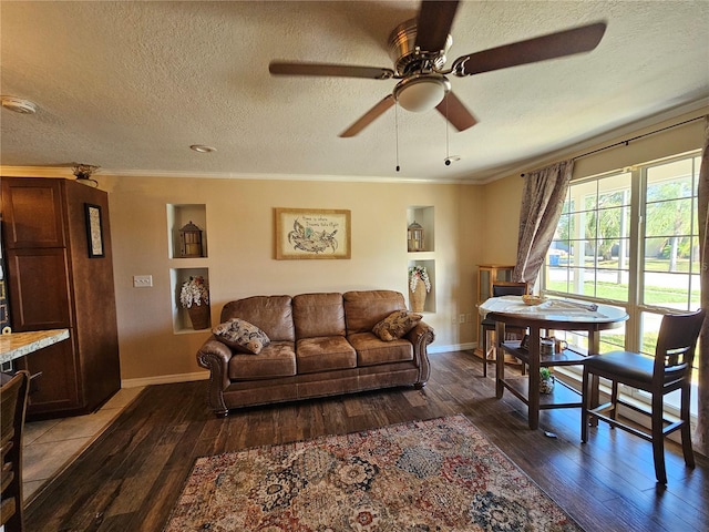 3141 Ludlow Dr, New Port Richey, FL 34655 - living room featuring hardwood / wood-style flooring, a textured ceiling, ceiling fan, baseboards, and crown molding