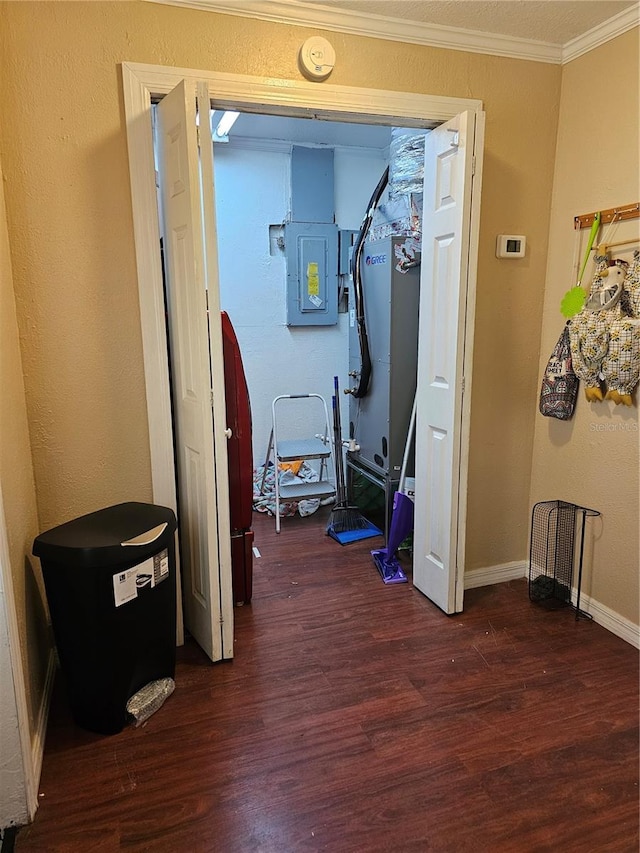 hall featuring dark hardwood / wood-style floors and crown molding