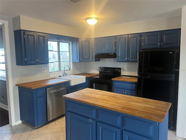 kitchen with wooden counters, blue cabinets, and black appliances