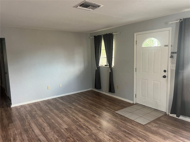 entrance foyer featuring hardwood / wood-style floors and a wealth of natural light