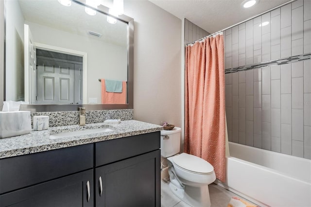 full bathroom with vanity, tile patterned floors, toilet, a textured ceiling, and shower / tub combo with curtain