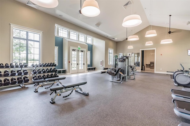 workout area with french doors and high vaulted ceiling