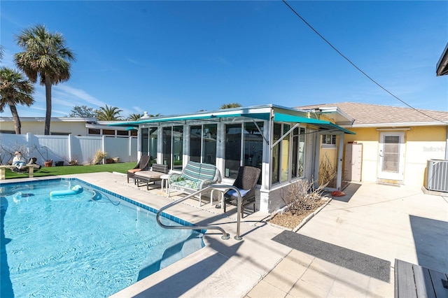 view of pool featuring cooling unit and a patio