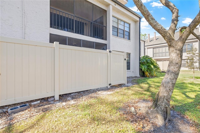 view of home's exterior featuring a yard