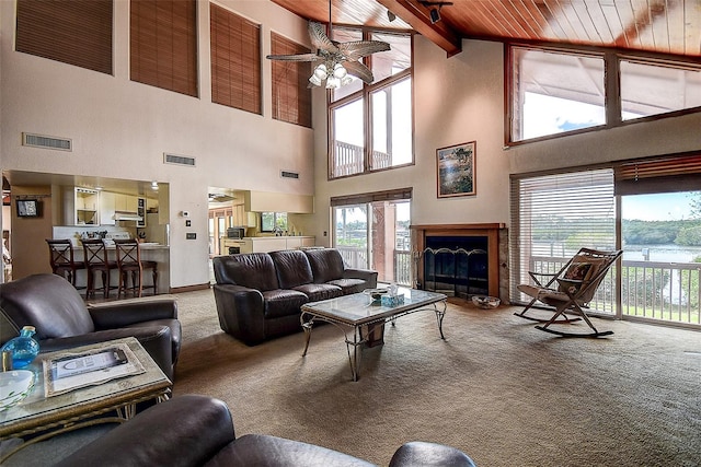 living room with carpet flooring, high vaulted ceiling, ceiling fan, and wood ceiling