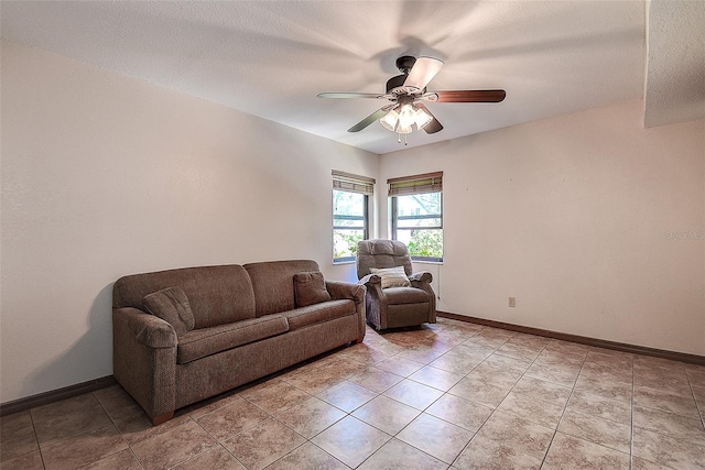 living room with light tile patterned floors and ceiling fan