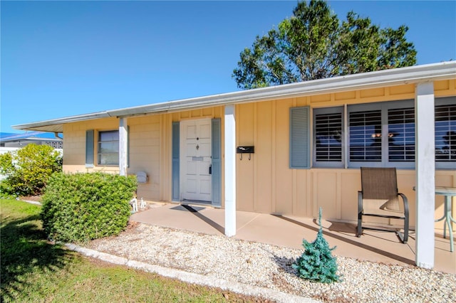 entrance to property with a patio