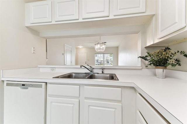 kitchen with white cabinetry, sink, a notable chandelier, and white dishwasher